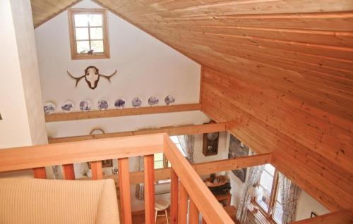an attic view of a room with wooden ceilings at Cozy Home In Dingle With Lake View in Dingle
