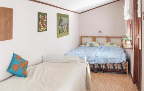Ένα ή περισσότερα κρεβάτια σε δωμάτιο στο Two-Bedroom Holiday Home In Rottne