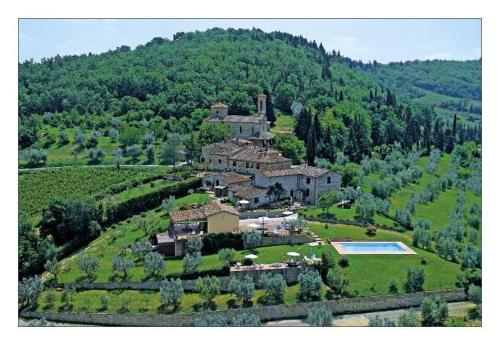 an aerial view of a house on a hill at Borgo Sicelle Residence in San Donato in Poggio