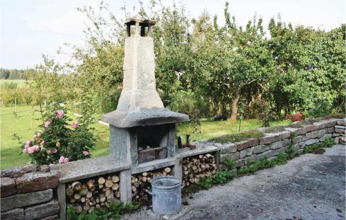 a stone oven in a stone retaining wall at 2 Bedroom Lovely Home In Degerhamn in Gammalsby
