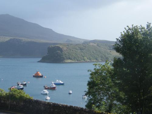 
a large body of water with boats in it at Braeside Guest Rooms in Portree
