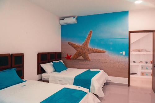 A bed or beds in a room at Hotel Casa Arnaldo "Esmeraldas"