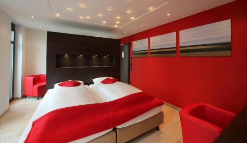 Postel nebo postele na pokoji v ubytování KH Hotel mit Restaurant