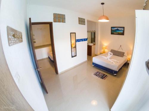 a view of a bedroom with a bed in a room at San Pedro Suite in San Pedro La Laguna