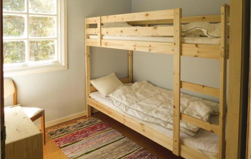 a bunk bed in a room with a bunk bedutenewayangering at Four-Bedroom Holiday Home In Trosa in Trosa