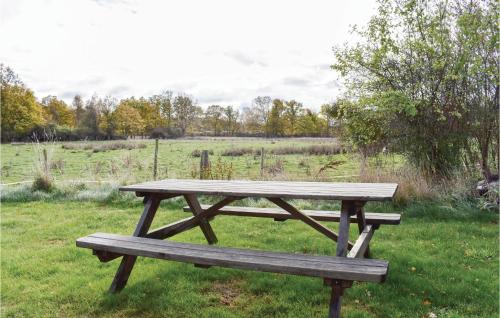 a wooden picnic table sitting in a field at 2 Bedroom Gorgeous Home In Jämjö in JÃ¤mjÃ¶