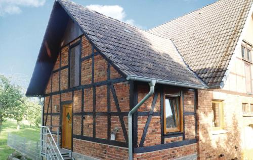 a brick house with a black roof at Nice Apartment In Lügde With Wifi in Lügde