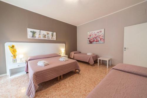Postel nebo postele na pokoji v ubytování B&B Siracusa Holidays