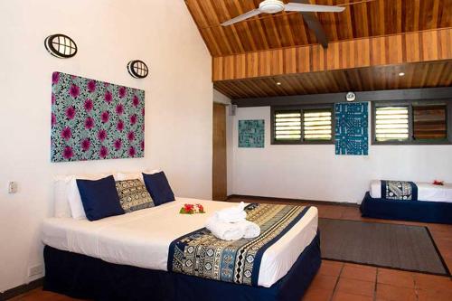 Belo Vula Island Resort Limited tesisinde bir odada yatak veya yataklar