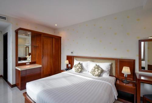 Katil atau katil-katil dalam bilik di Aquari Hotel