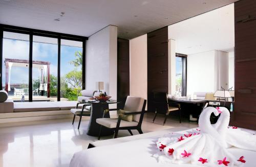 a bedroom with a bed with a swan on it at The Mangrovetree Sanya Resort in Sanya