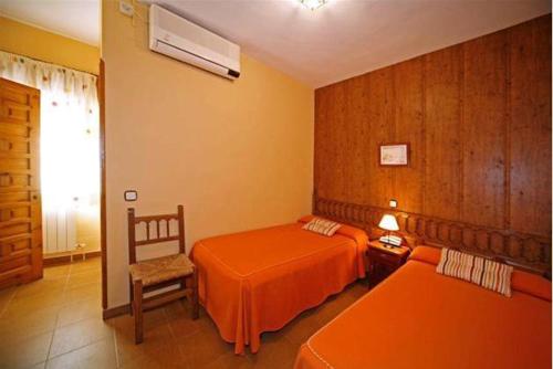 Postel nebo postele na pokoji v ubytování Hostal Chinchon