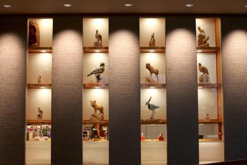 a display case in a store withanimal figurines at Kamikochi Hotel Shirakabaso in Matsumoto