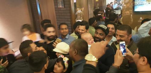 a group of people standing around in a crowd at Hotel Makhan Residency in Amritsar