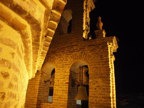 a building with a bell on the side of it at Hotel Convento Aracena & SPA in Aracena