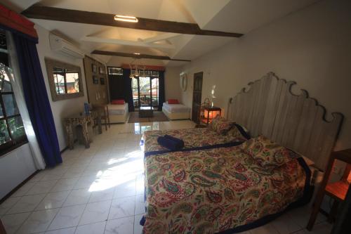 a bedroom with a large bed in a room at Bamboo Paradise in Padangbai