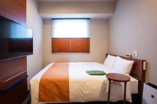 Letto o letti in una camera di Kitanoniwa The Kuretakeso