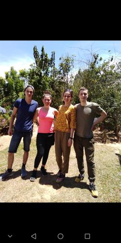 a group of people posing for a picture at Forest Cyniciam Homestay in Ohiya