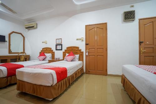 Tempat tidur dalam kamar di SUPER OYO 1173 Hotel Shofa Marwah