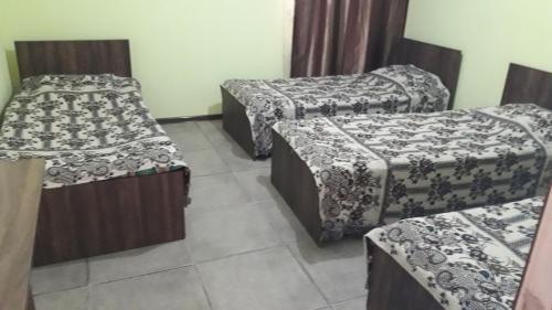 a room with three beds in a room at kobuleti bagrationi 40 in Kobuleti
