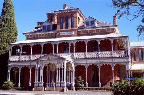 a large red and white building with a turret at The Sampson - Orange in Orange