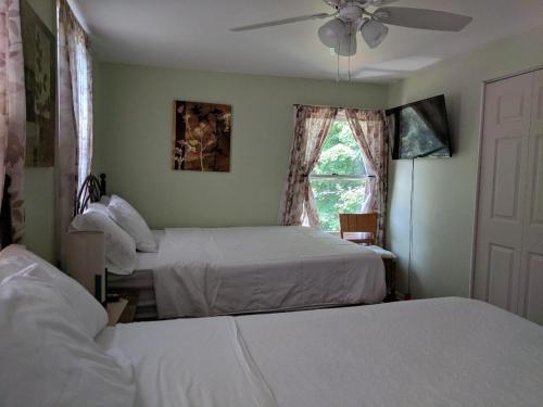 Een bed of bedden in een kamer bij Vinzos Properties