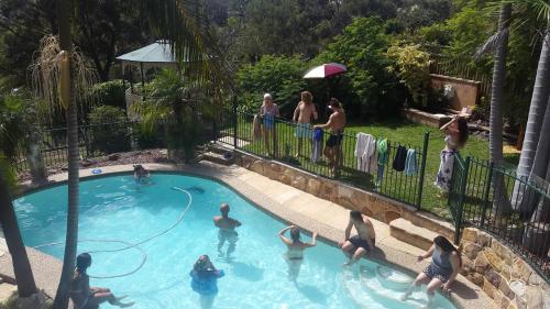 a group of people playing in a swimming pool at Serenity in Sutherland