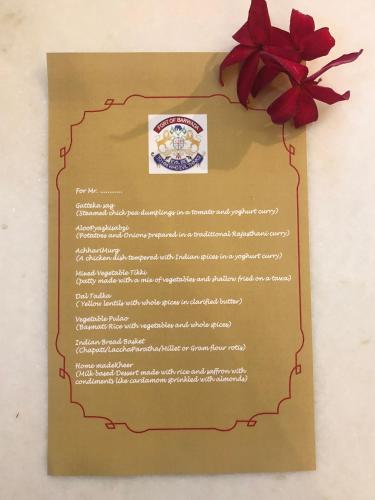 a certificate with a red bow on top of it at Barwara Kothi in Jaipur