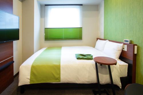 Letto o letti in una camera di Kitanoniwa The Kuretakeso