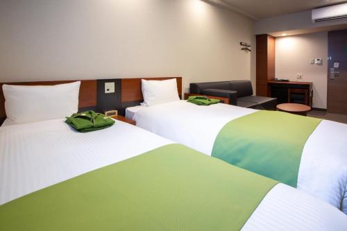 Letto o letti in una camera di Kitanoniwa The Kuretakeso