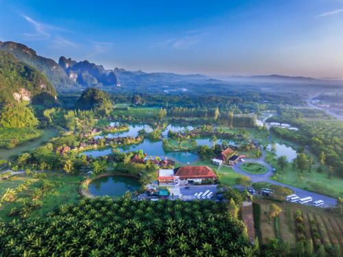 an aerial view of a resort on a river at Bor Saen Pool Villa in Bor Saen