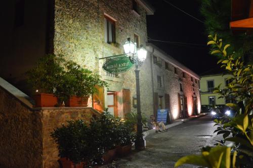 a street sign on the side of a building at night at Hotel Ristorante Antica Marina in Nicotera Marina