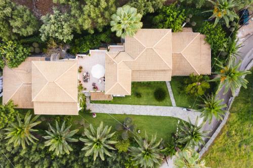 an aerial view of a house with a roof at Villa Phoenix in Keri
