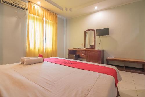 Katil atau katil-katil dalam bilik di RedDoorz Syariah at Grand Taufiq Tarakan