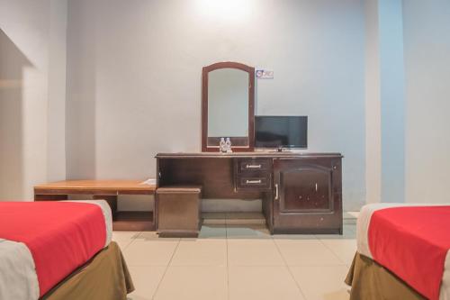 Televisyen dan/atau pusat hiburan di RedDoorz Syariah at Grand Taufiq Tarakan