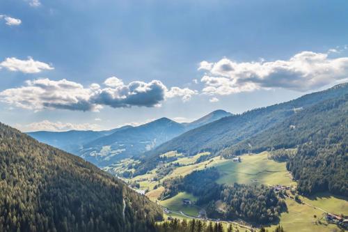 a view of a valley in the mountains at Boutique Hotel Kircher in Sarntal