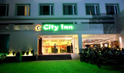 a store with bikes parked in front of a building at Hotel City Inn in Varanasi
