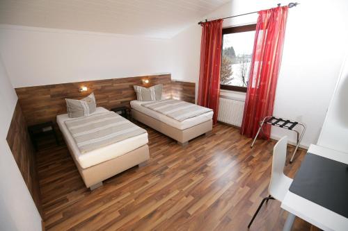 Ένα ή περισσότερα κρεβάτια σε δωμάτιο στο Apartments am Baronenwald