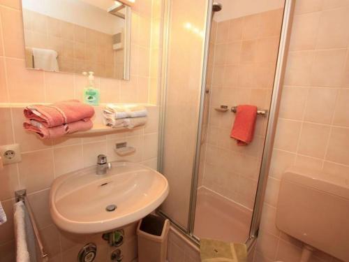 a bathroom with a sink and a shower at Ferienwohnung Wagner in Bad Bellingen