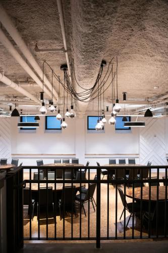 a room with a long table and chairs and lights at TRYP by Wyndham Pittsburgh/Lawrenceville in Pittsburgh