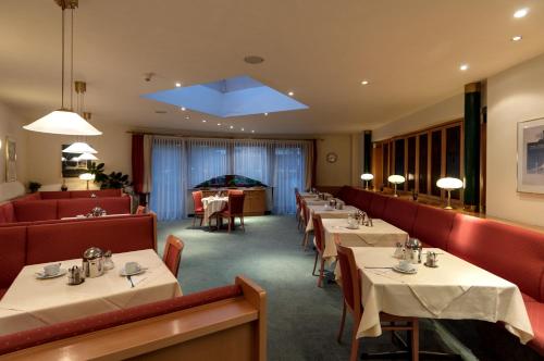 Ресторант или друго място за хранене в Club Hotel Cortina
