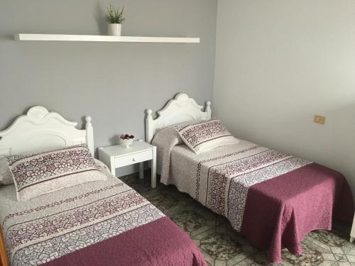 Ένα ή περισσότερα κρεβάτια σε δωμάτιο στο Orzola mar y relax