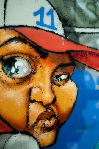 a painting of a baseball player wearing a hat at Hôtel le Pastel in Toulouse