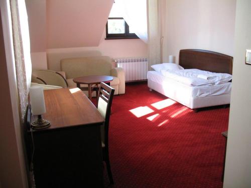 Postel nebo postele na pokoji v ubytování Hotel Rytwiany