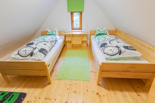 En eller flere senge i et værelse på Ferienhaus Göstling