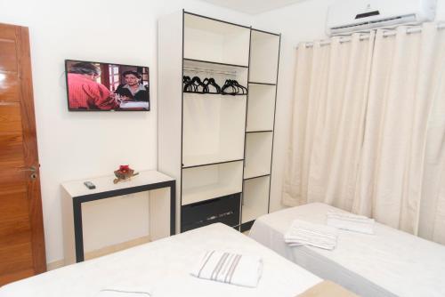 a room with a mirrored closet with shoes in it at CASA TORRES in Bonito