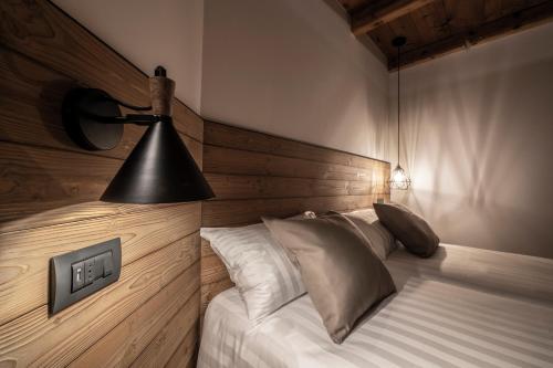 Casa Pasini-Foresteria tesisinde bir odada yatak veya yataklar