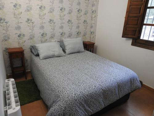 Postel nebo postele na pokoji v ubytování CASA DE LOS ALAMOS