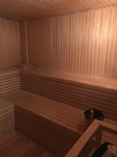 a sauna with a wooden bench in a room at Agua del Corral Hotel & Spa in Mendoza