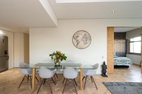 a dining room with a table and chairs at #1803 Cartwright - Simply Spectacular in Cape Town